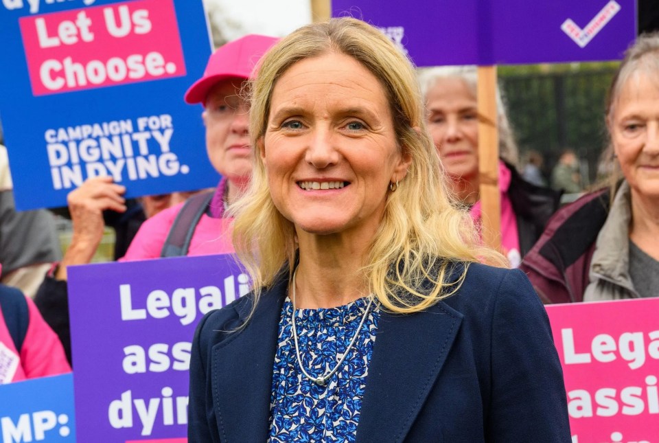 a woman holding a sign that says " legalise assisted dying and let us choose "