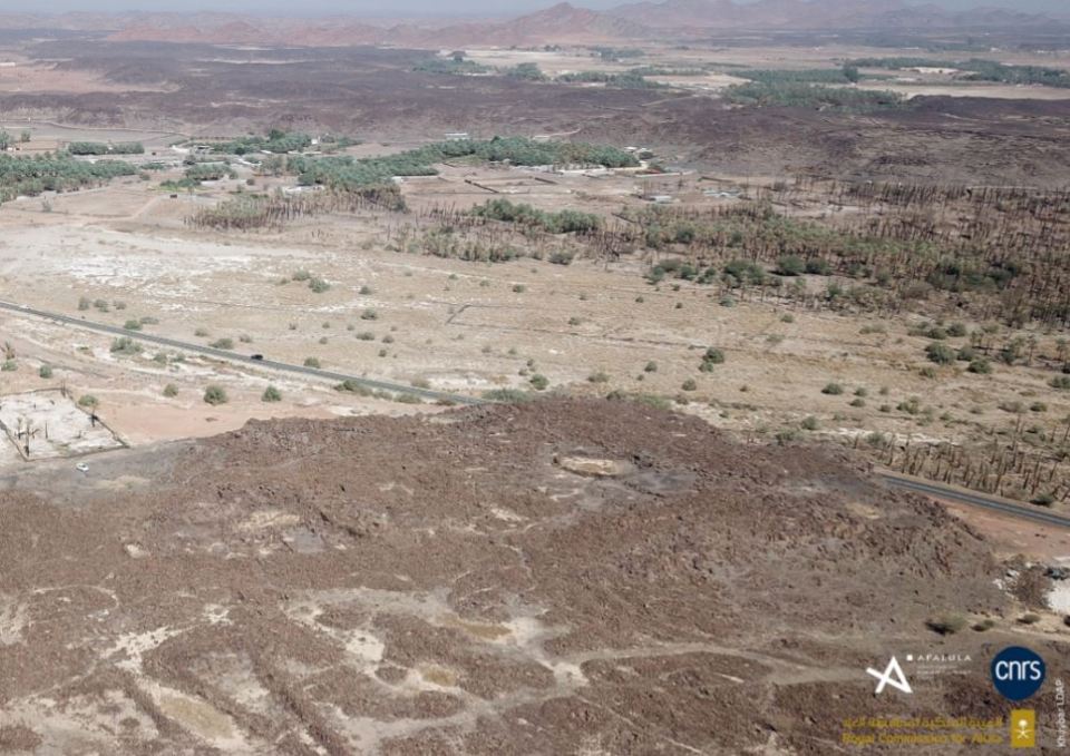 an aerial view of a desert with a cnrs logo in the corner
