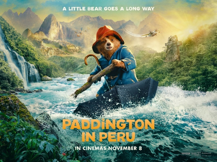 a movie poster for paddington in peru shows a bear holding an umbrella