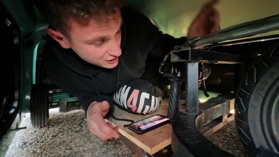 a man wearing a black shirt with the word mach on it