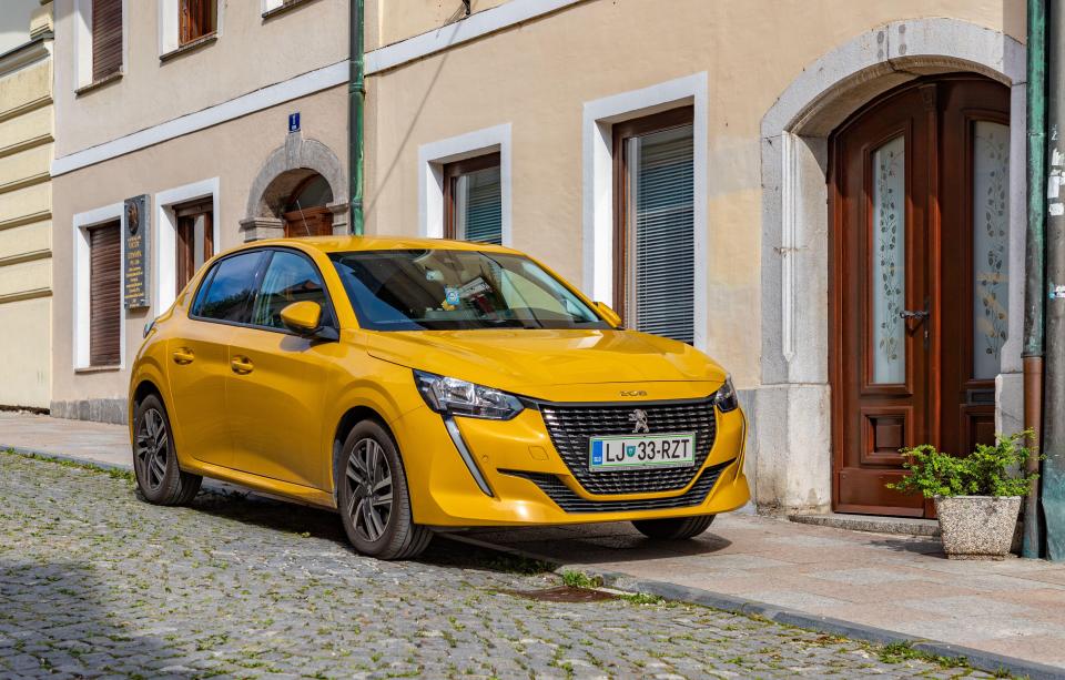 a yellow car with a license plate that says lj 33-rzt