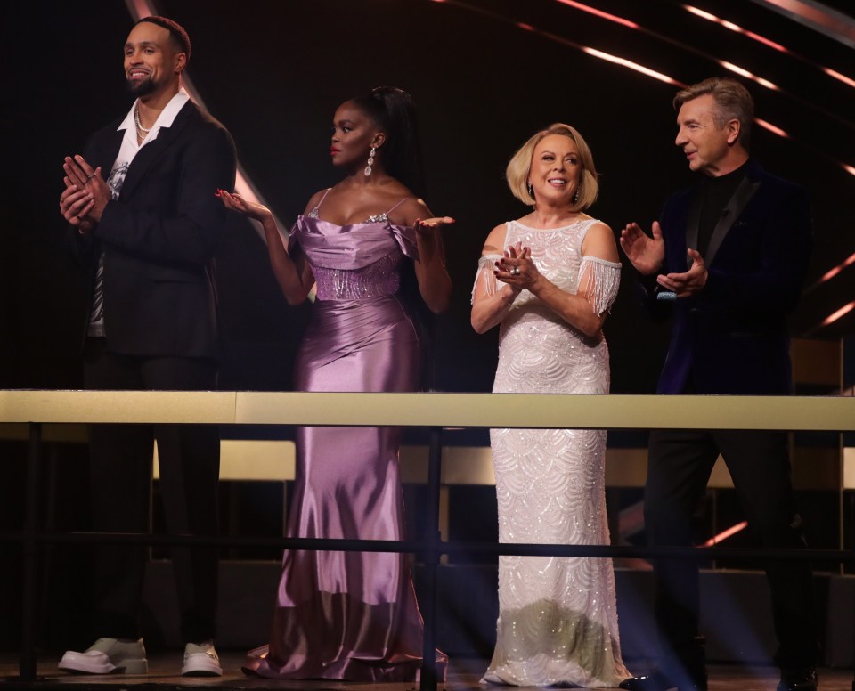 a group of people standing next to each other on a stage