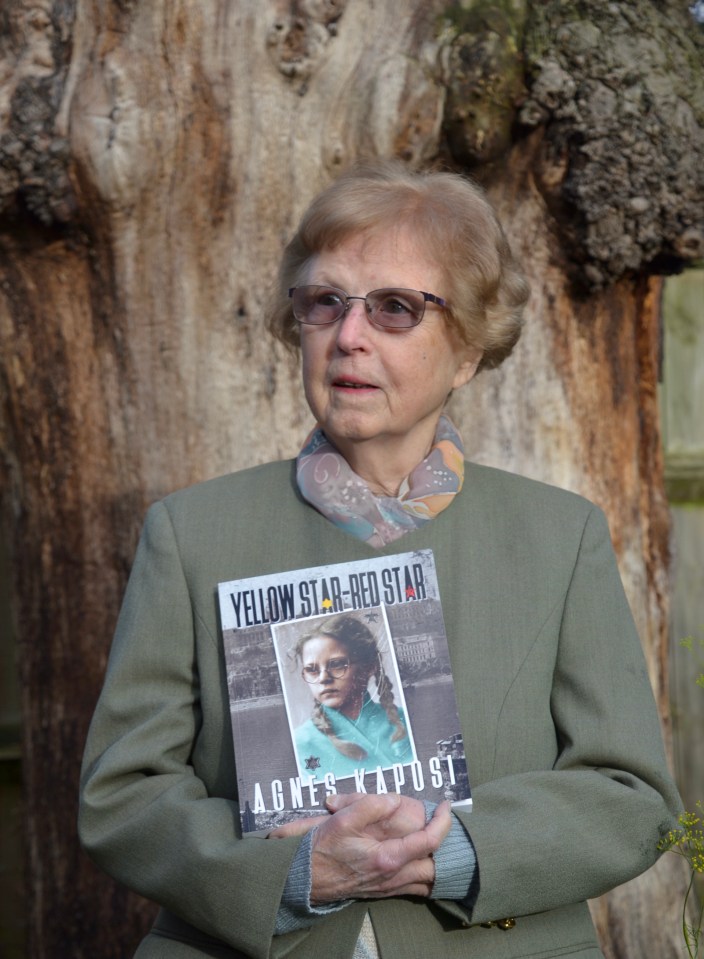 a woman holding a book titled yellow star red star