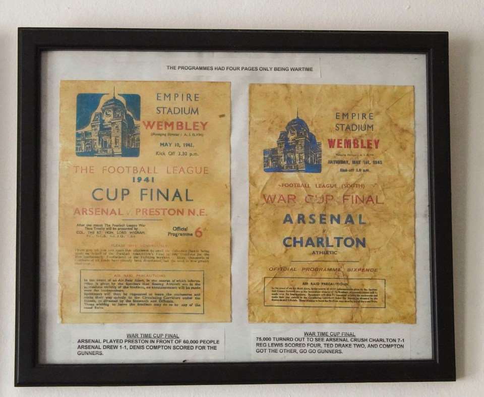 a framed copy of the empire stadium wembley football league programmes
