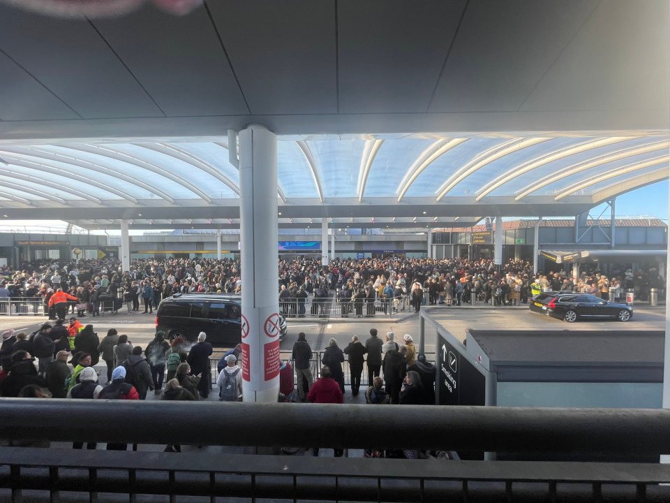 a large crowd of people are gathered outside of a building