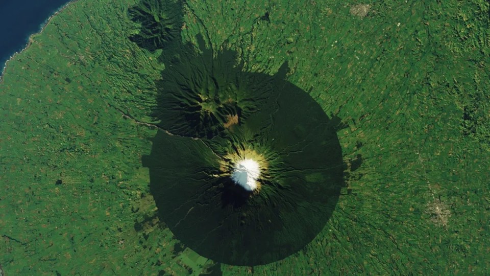 an aerial view of a volcano with a circle around it