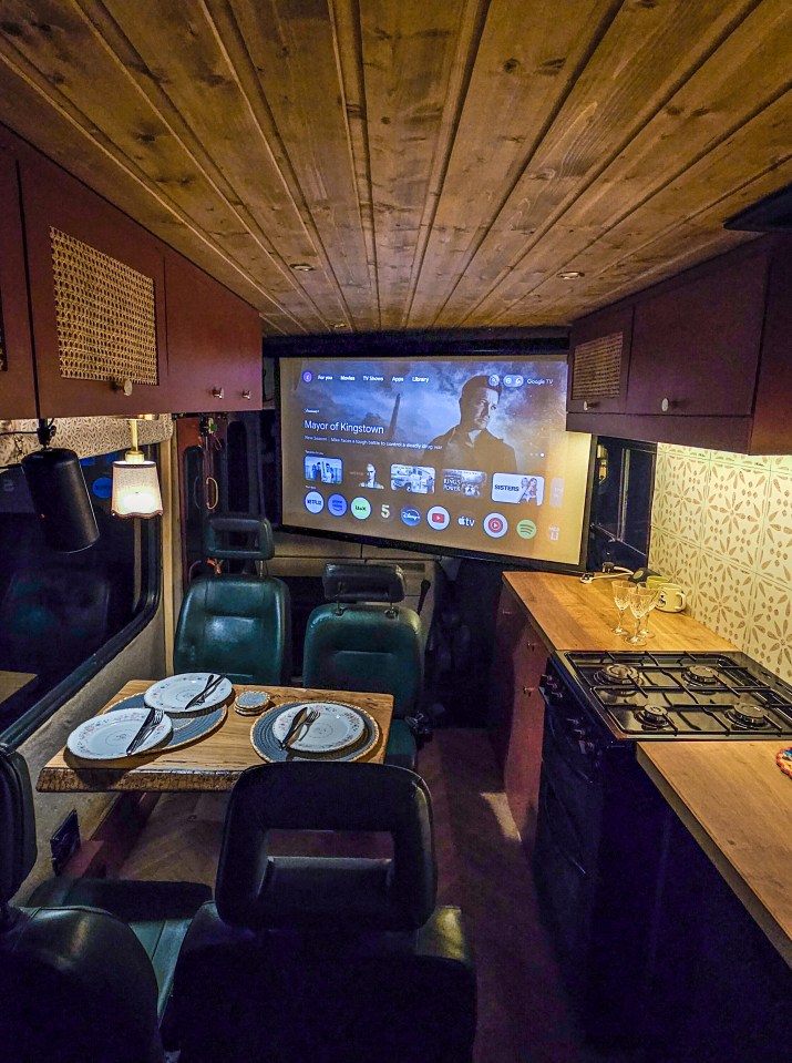 a projector screen shows a movie called a knight 's tale