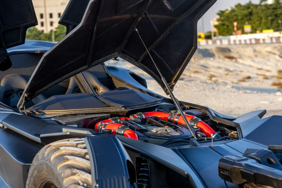 the hood of a vehicle is open and shows the engine