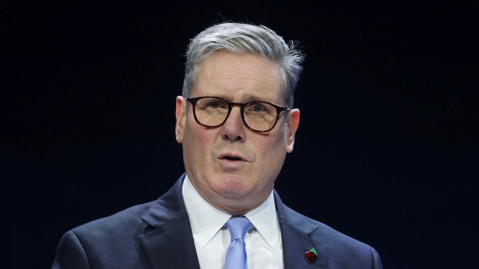 a man in a suit and tie is giving a speech
