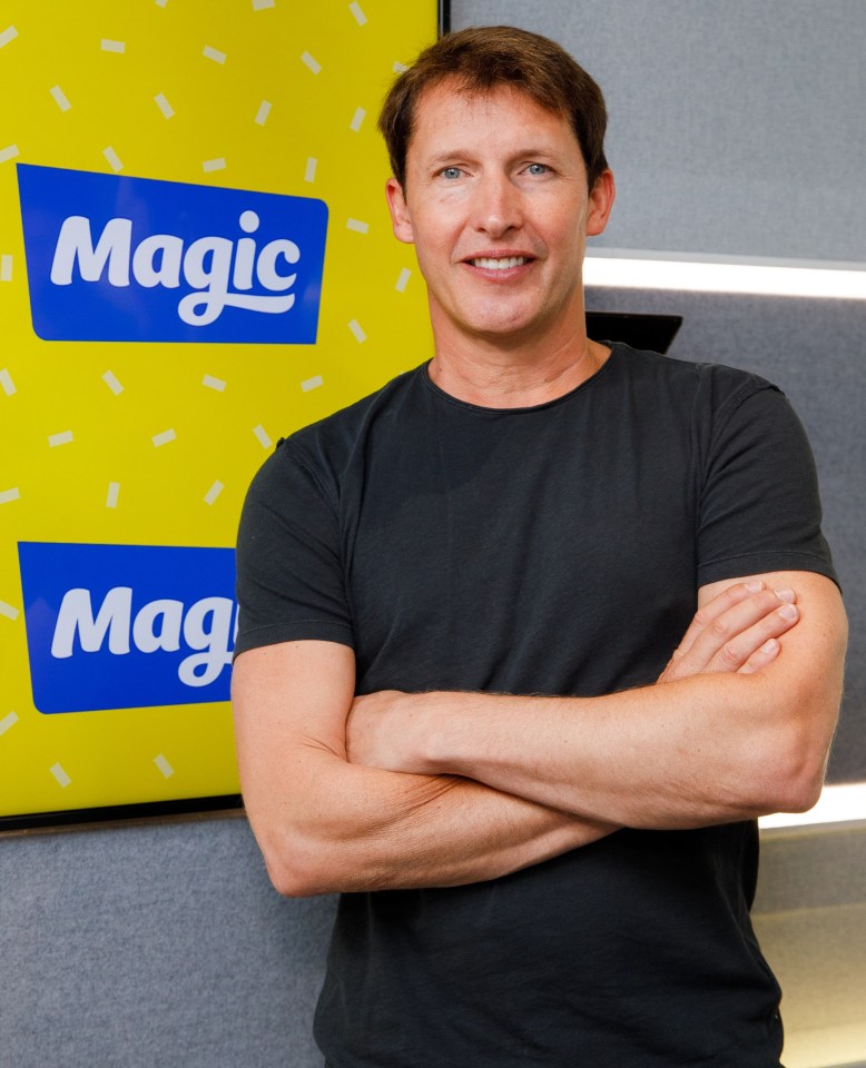 a man stands in front of a magic sign