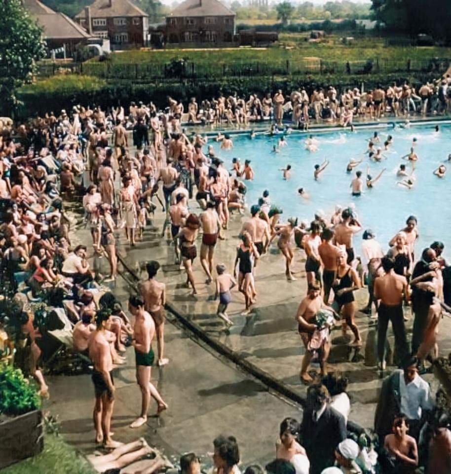 a large group of people are gathered around a swimming pool