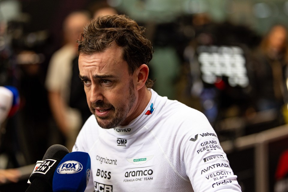 a man wearing a fox sports shirt talks into a microphone
