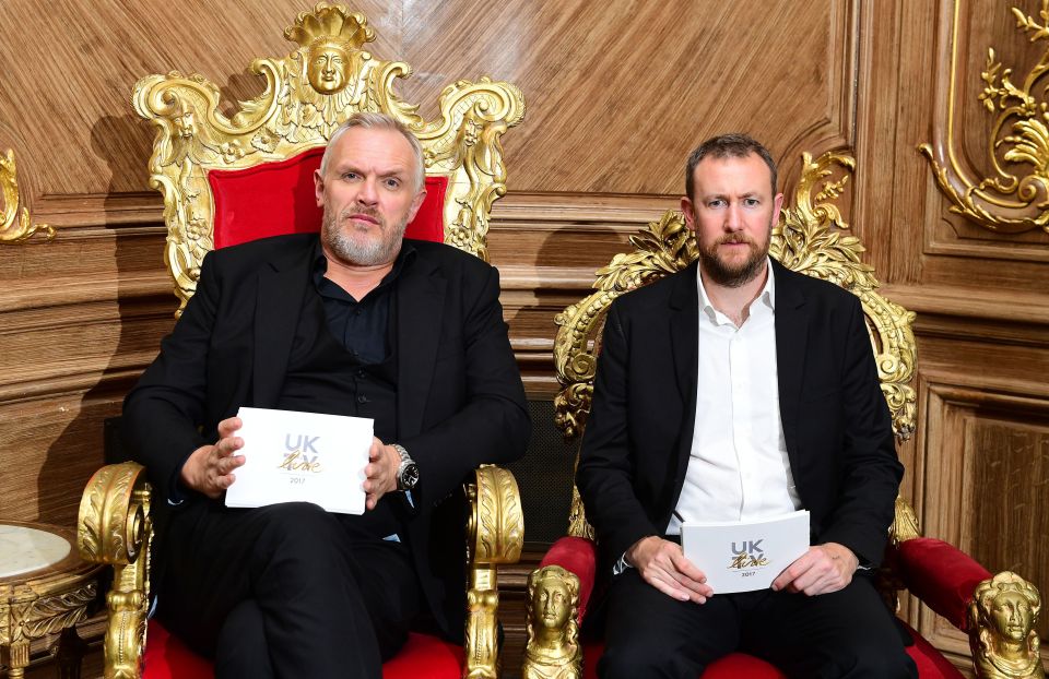 two men sitting on thrones holding papers that say uk talk