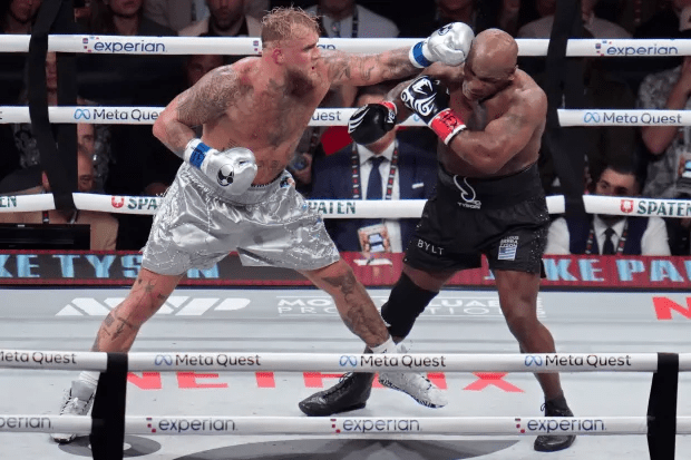 two boxers are fighting in a ring sponsored by experian