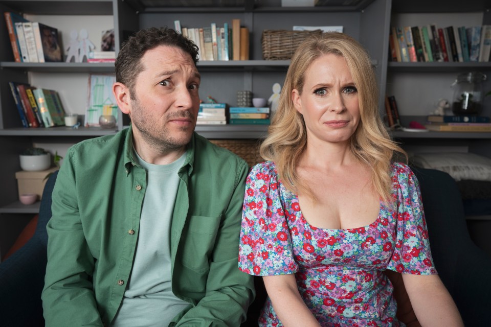 a man in a green shirt and a woman in a floral dress are sitting next to each other