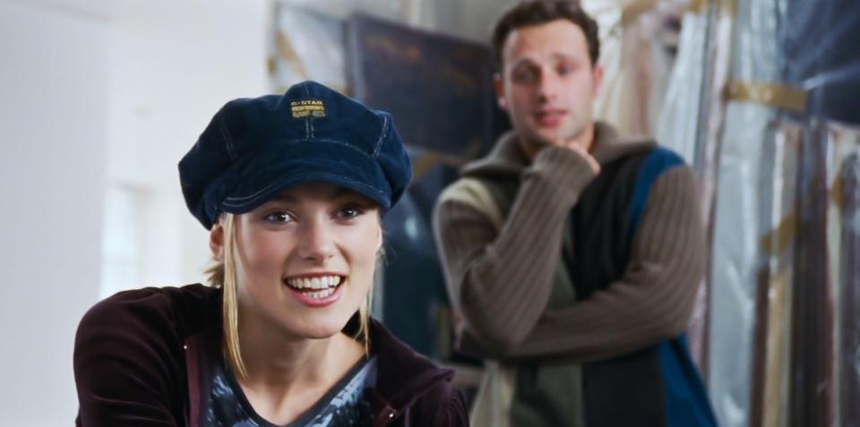 a woman wearing a hat that says g-star on it