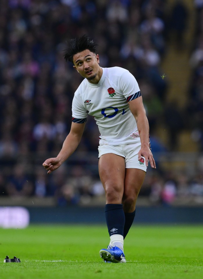 a rugby player wearing shorts that say ' england ' on them