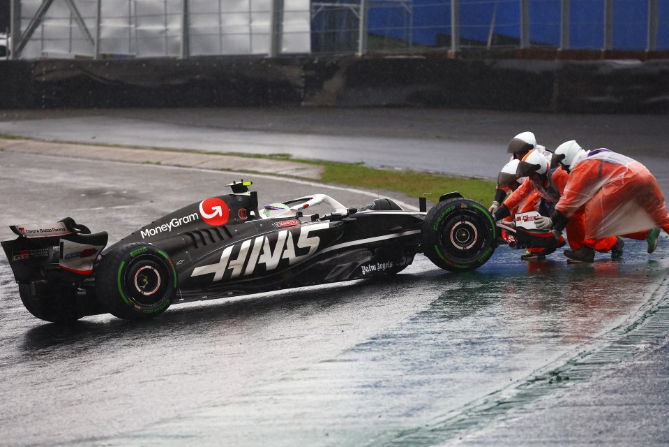 a race car with the word haas on it