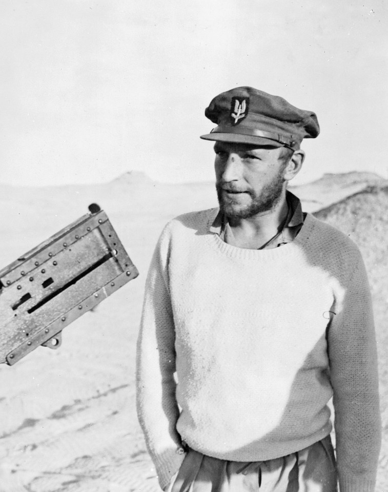 a man wearing a hat with the letter a on it