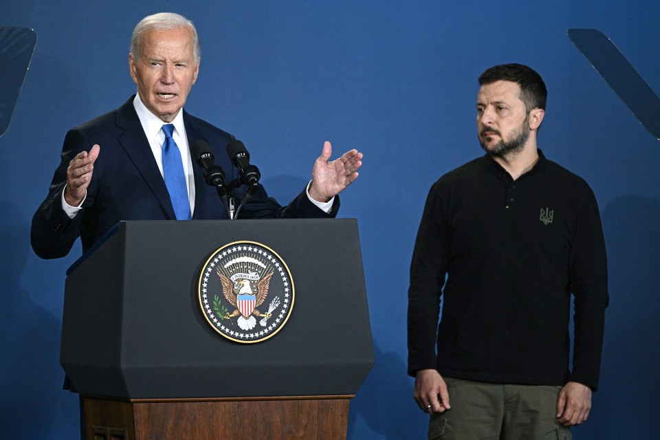 a man standing next to a podium with the seal of the united states on it