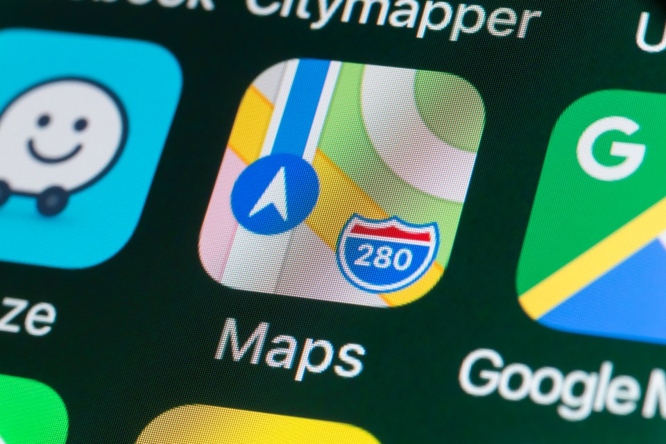 Apple Maps app icon on iPhone screen.
