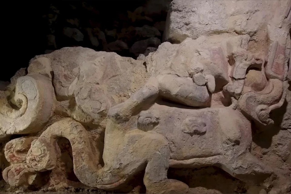 a statue of a person with a snake around their neck