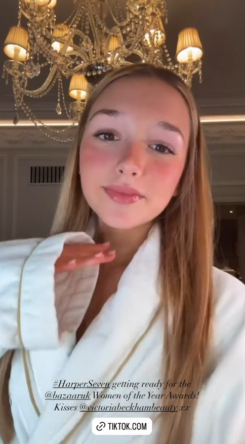 a woman in a white robe is getting ready for the harper seven women of the year awards