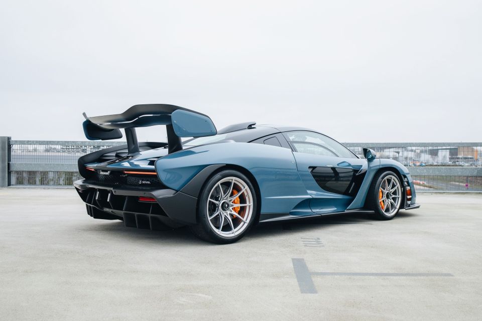 Rear view of a blue McLaren Senna XP hypercar.