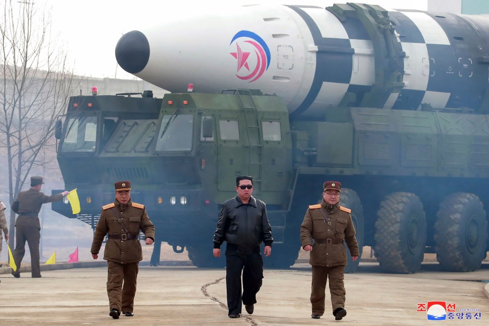 North Korean tyrant Kim Jong-Un walks around what it says is a Hwasong-17 intercontinental ballistic missile