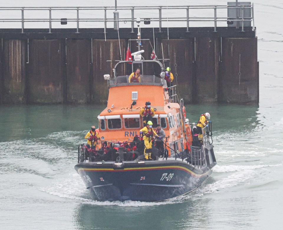 Rescued migrants arriving in Dover on an RNLI lifeboat.