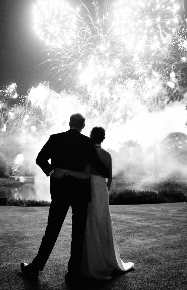 Prince Harry and Meghan Markle watching fireworks at their wedding reception.