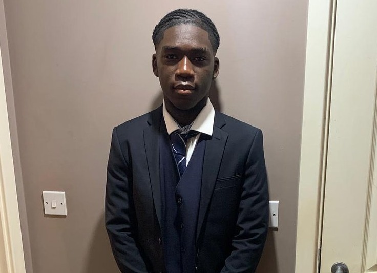 Marcus Fakana, 18, in a suit.