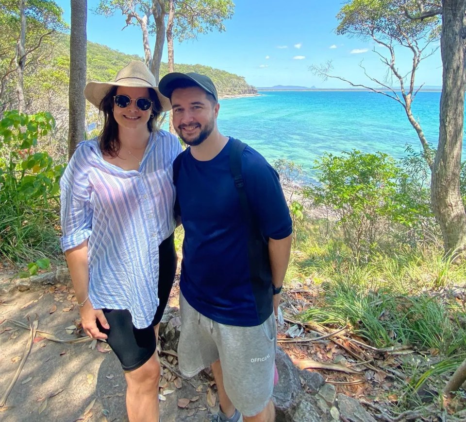 Couple enjoying scenic Australian beach view.