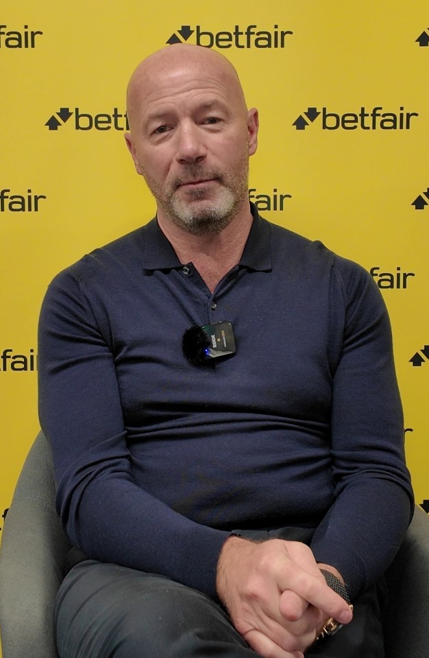Man sitting in front of a Betfair-branded backdrop.