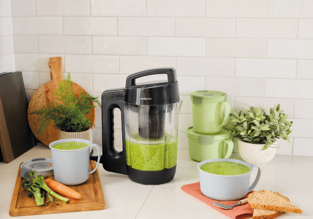 Ambiano soup maker with green soup and bowls.