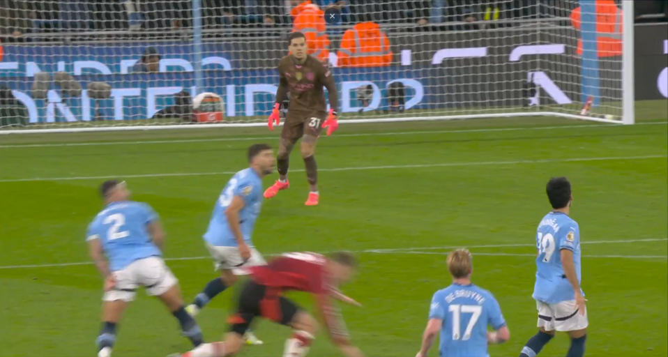 Soccer players near the goal.