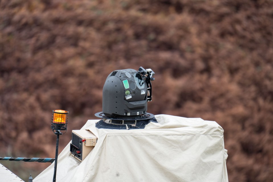 A surveillance camera mounted on a vehicle.