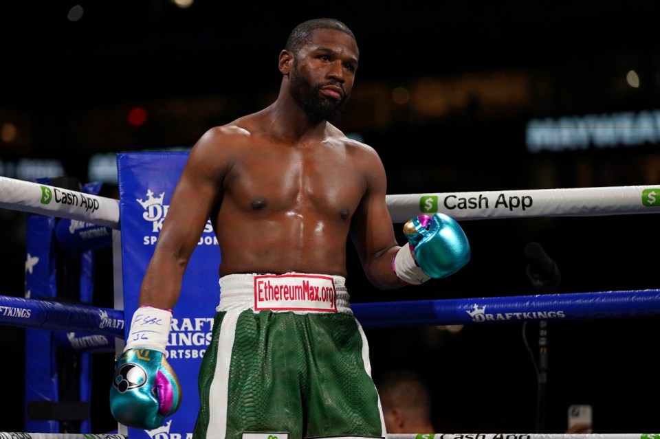 Floyd Mayweather Jr. in boxing ring.