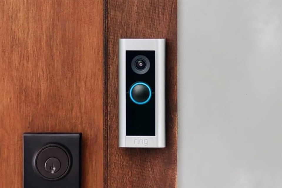 Ring video doorbell mounted on a door.