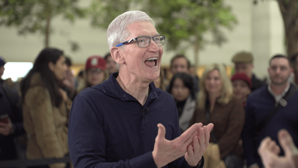 Tim Cook speaking enthusiastically to a crowd.