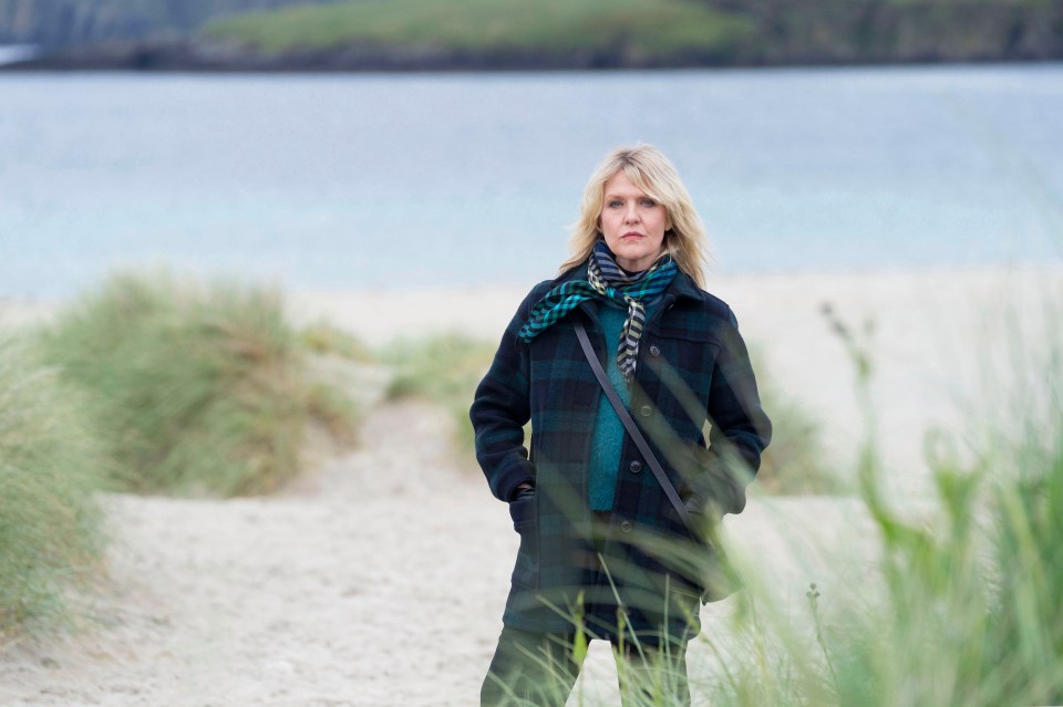 Ashley Jensen as DI Ruth Calder on a beach.