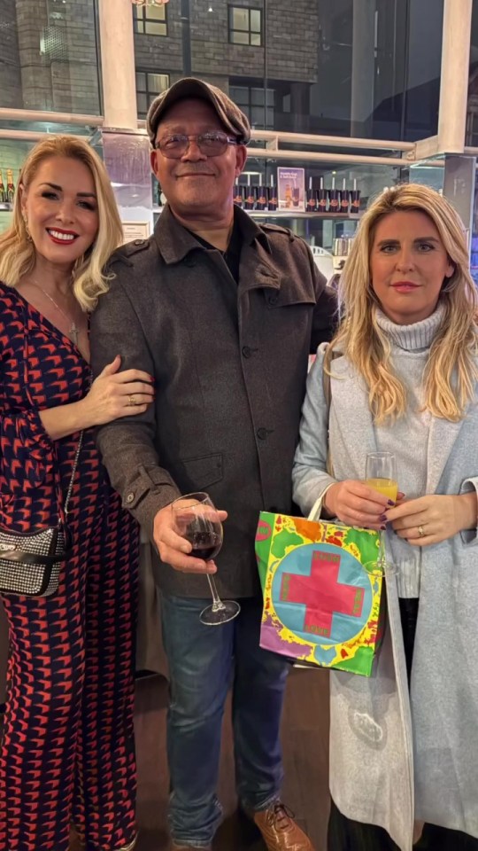 Claire Sweeney and Louis Emerick with another person at a social event.