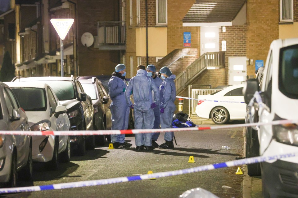 Forensic officers at a triple shooting crime scene.