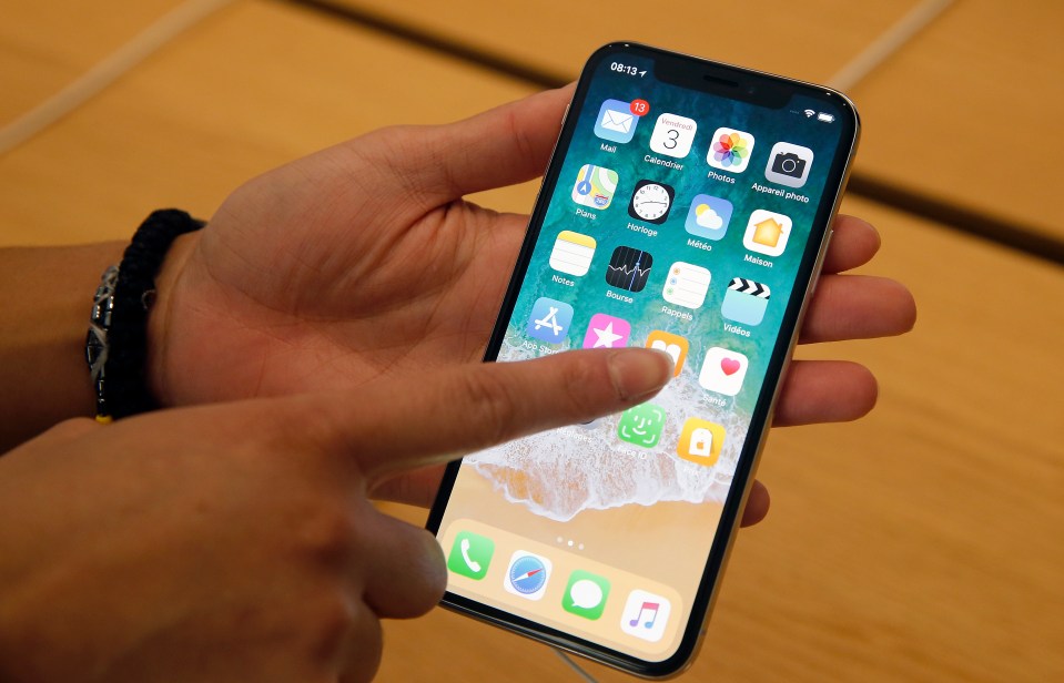 Person using an iPhone X.