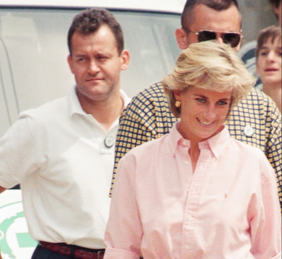 Princess Diana in Bosnia, with Paul Burrell, her butler, in the background.