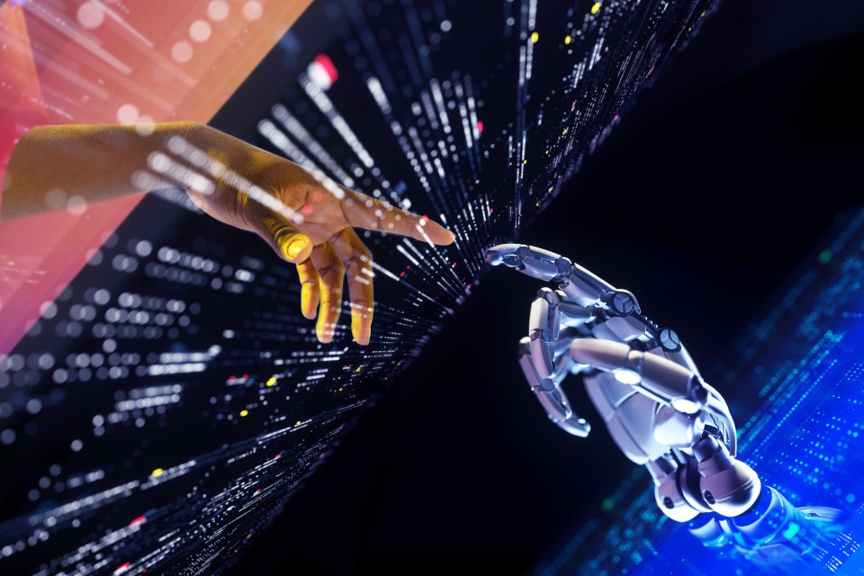 Human and robotic hands reaching toward each other through a digital portal.