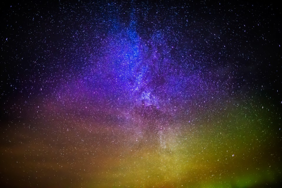 Milky Way galaxy with Northern Lights.