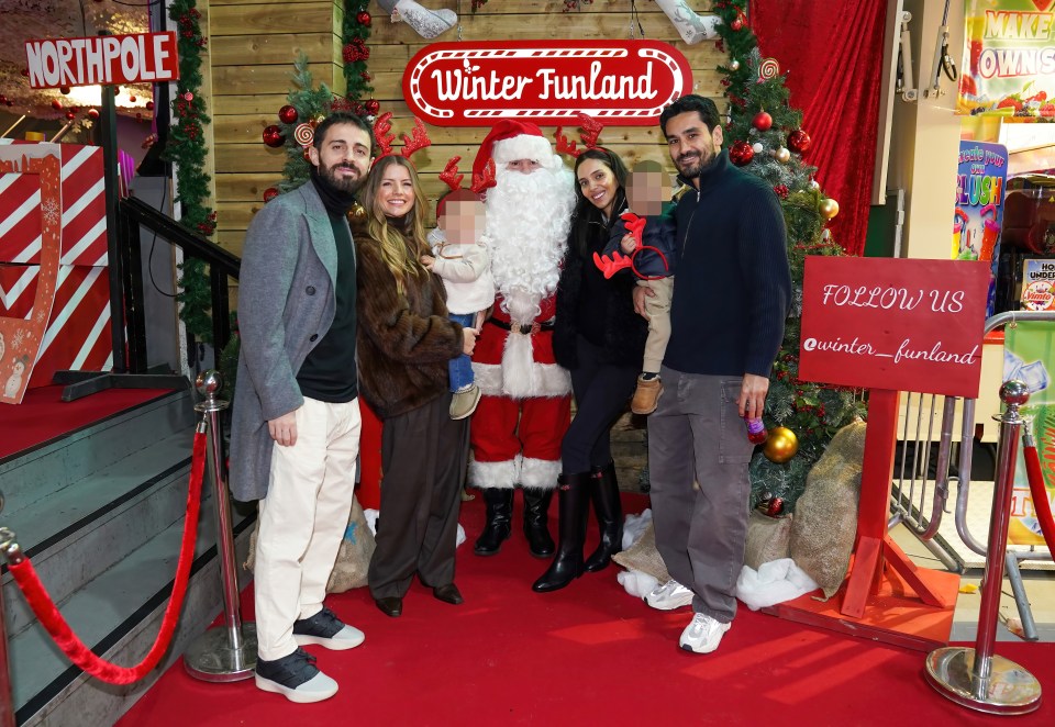 Manchester City players with their families at a Winter Funland.