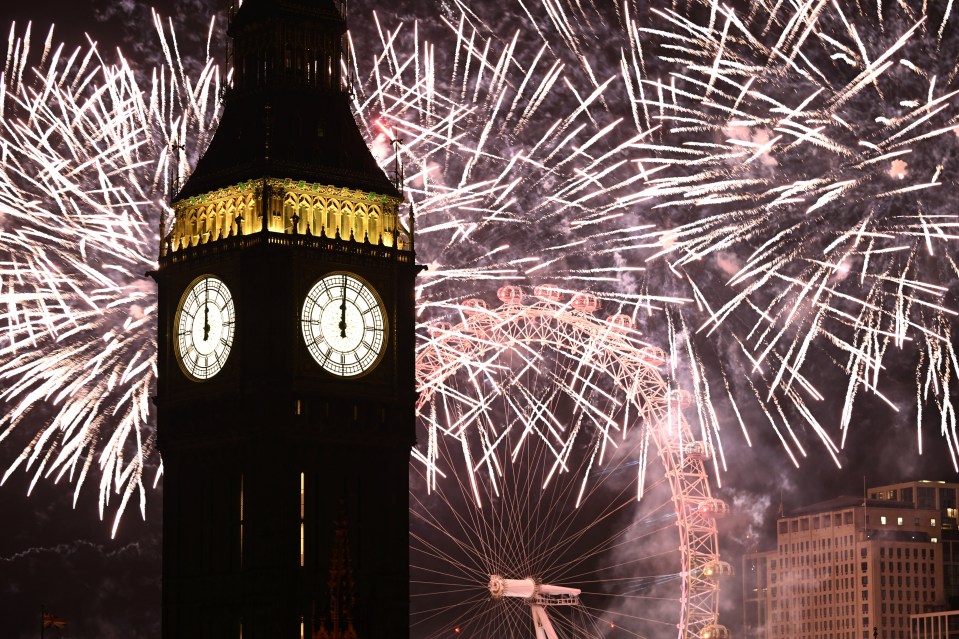 Fireworks over London's skyline, Big Ben, and the London Eye.