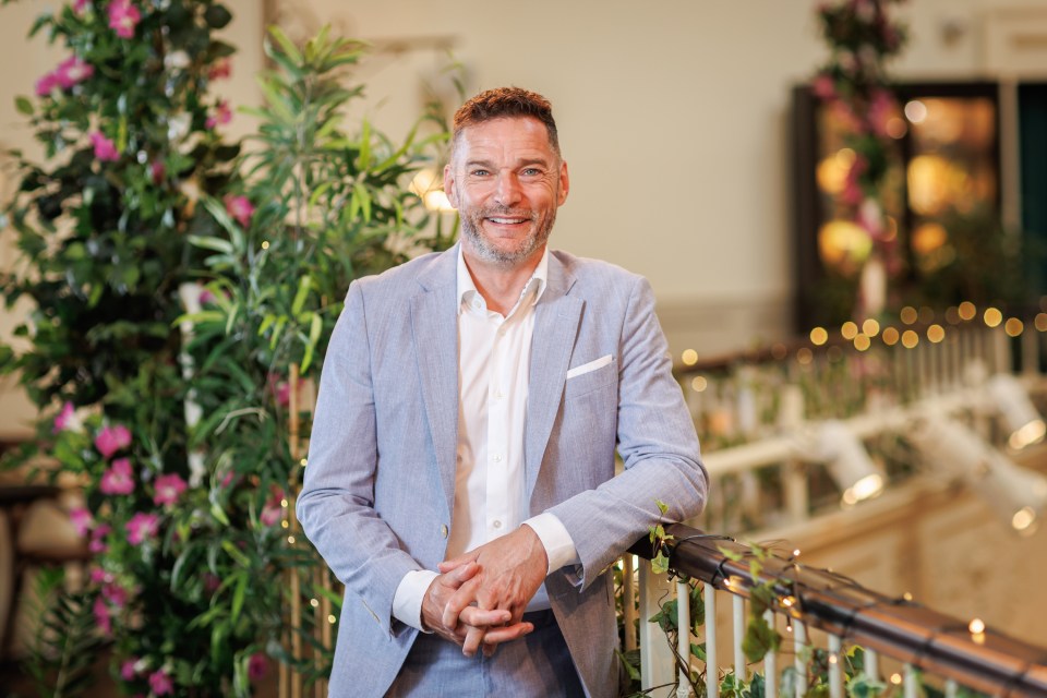 Fred Sirieix smiling for a portrait.